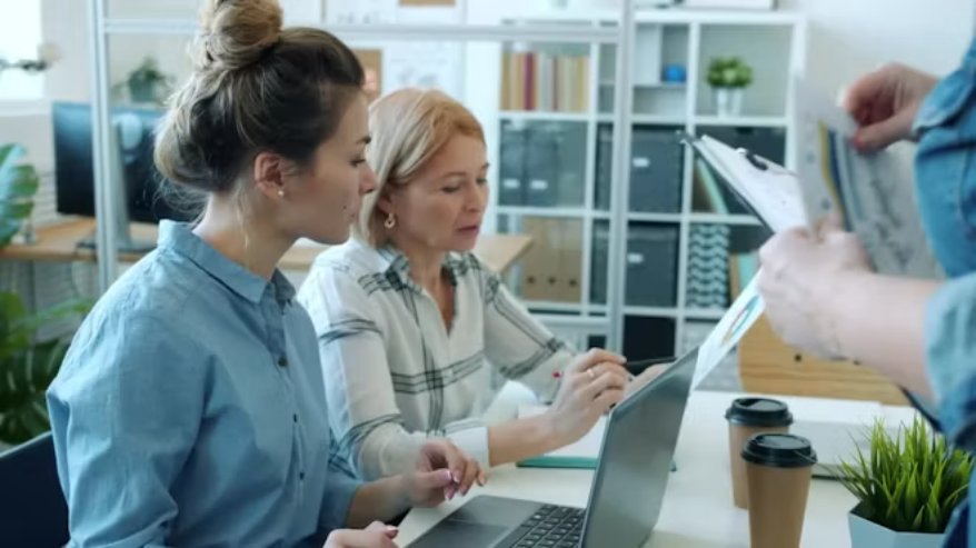 Professionals reviewing contracts, documents and obligations through a controlled process.