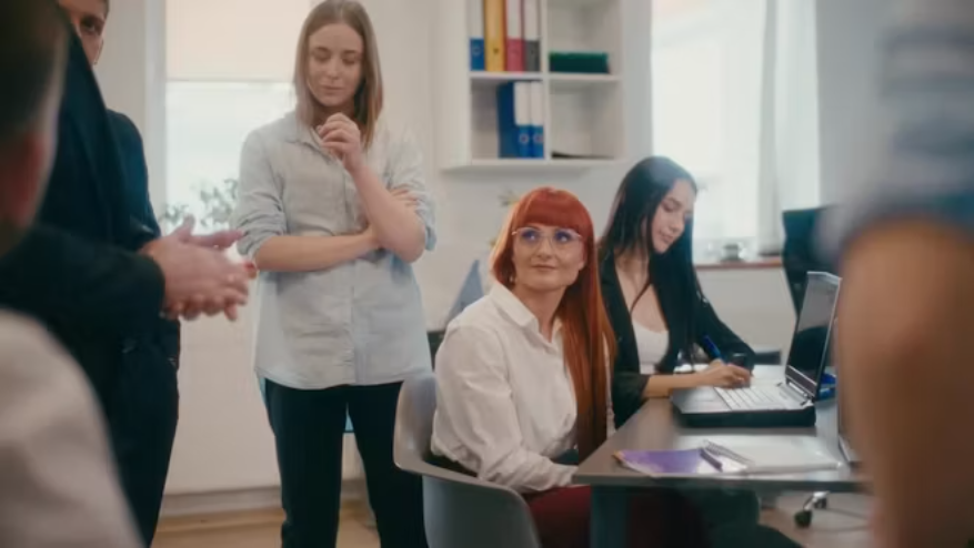 Marketing and business team reviewing campaign work before release.
