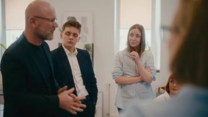 Marketing and business team reviewing campaign work before release.